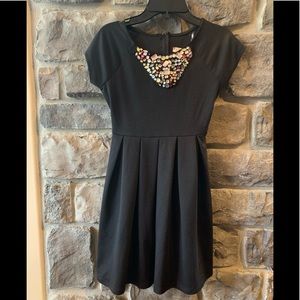 A girl’s black dress